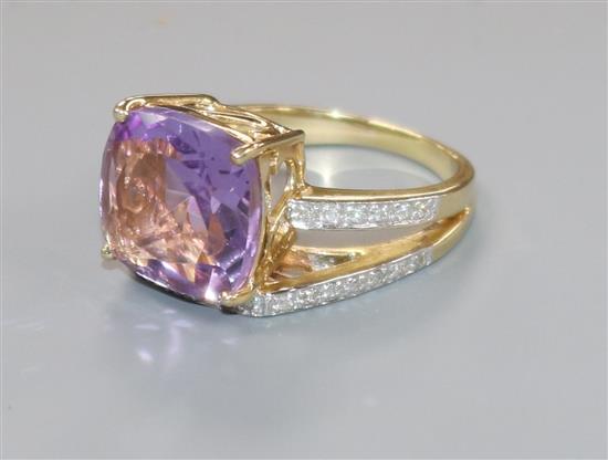 A modern 14ct gold, amethyst and diamond dress ring, size O.